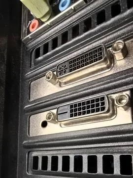 Detailed view of a computer back panel with multiple connection ports Stock Photos