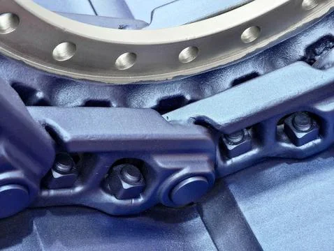Detailed view of construction machine track components showcasing their robust Stock Photos