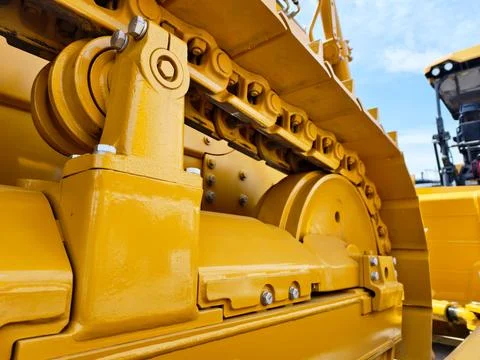 Detailed view of construction machine track components showcasing precision Stock Photos