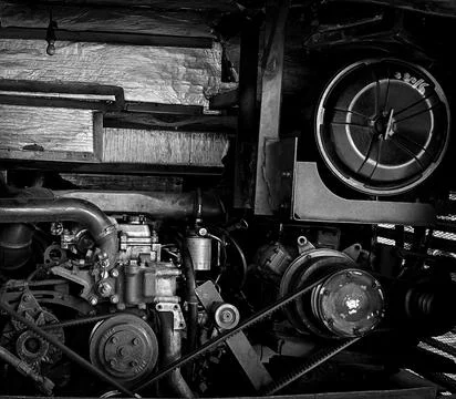 Detailed view of a double decker bus engine bay showing belts, pulleys, rad.. Stock Photos