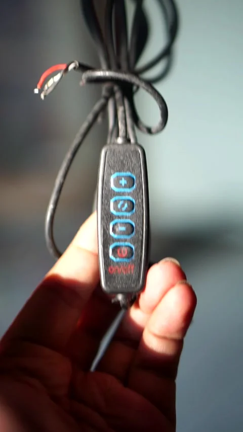 Detailed view of electronic device controller switch with light intensity Stock Footage 335896838