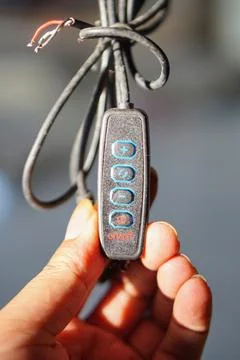 Detailed view of electronic device controller switch with light intensity Stock Photos