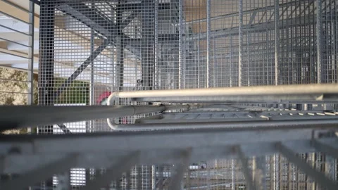 Detailed view of a fire escape staircase made of galvanized steel. Such structur Stock Footage 306008043