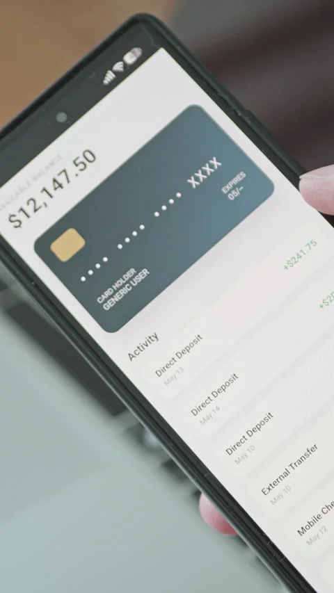 Detailed view of a generic mobile banking app displaying automated revenue Stock Footage 335525079