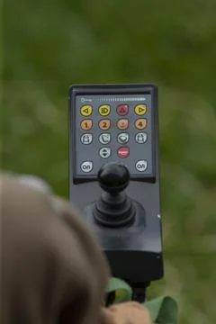 Detailed view of hand engaging controls on mobility device outdoors scene Stock Photos