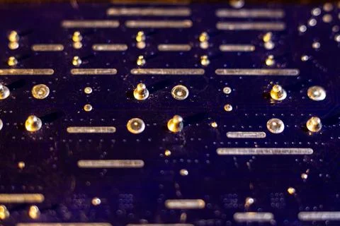 Detailed view of high tech hardware components on a dark blue substrate Stock Photos