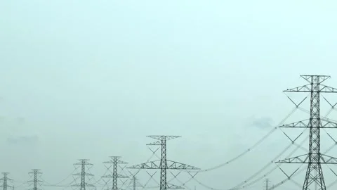 A detailed view of a high-voltage power tower standing tall. Stock Footage 306142437