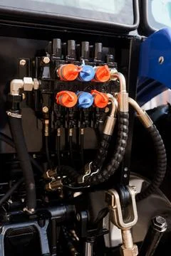 Detailed view of hydraulic system components on farm machinery for industrial Stock Photos