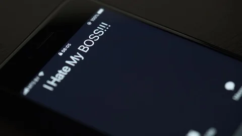 Detailed view: I Hate My Boss incoming call on the screen of smartphone.Morning. Stock Footage 126120787