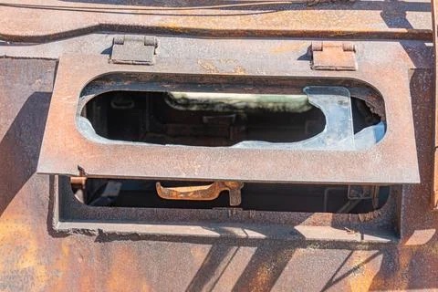 A detailed view of the interior of a war-torn car, with rust and decay taking Stock Photos