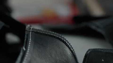 Detailed View of Leather Shoe Upper with Stitching in Manufacturing Workshop Stock Footage 341668870
