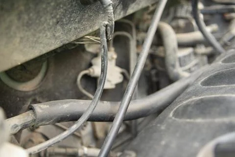 Detailed view of a modern car engine with exposed elements under the hood. .. Stock Photos