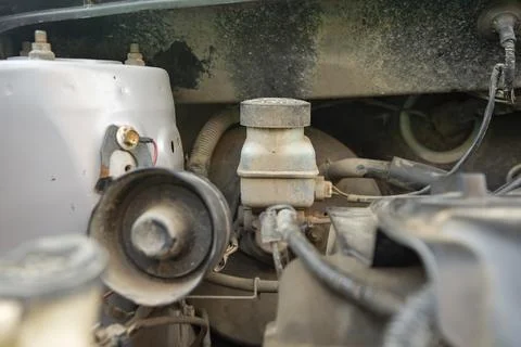 Detailed view of a modern car engine with exposed elements under the hood. .. Stock Photos