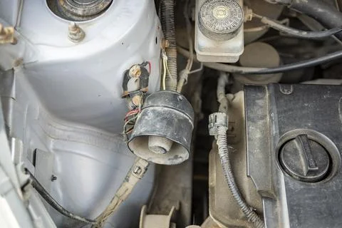 Detailed view of a modern car engine with exposed elements under the hood. .. Stock Photos