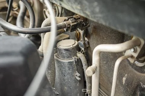 Detailed view of a modern car engine with exposed elements under the hood. .. Stock Photos