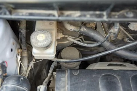 Detailed view of a modern car engine with exposed elements under the hood. .. Stock Photos