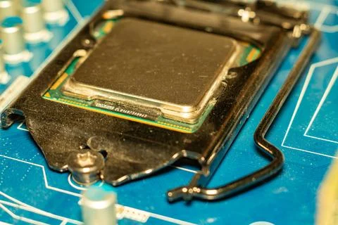 A detailed view of a modern computer processor installed on the motherboard Foto stock