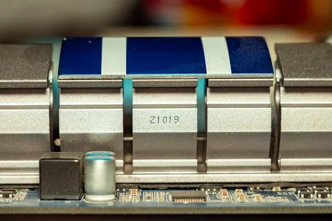A detailed view of modern electronic components on a printed circuit board Stock Photos