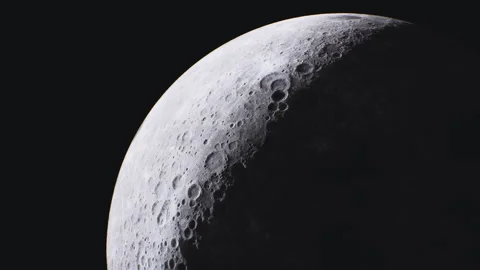 Detailed view of the moons surface highlighting its craters and texture Stock Footage 331423959