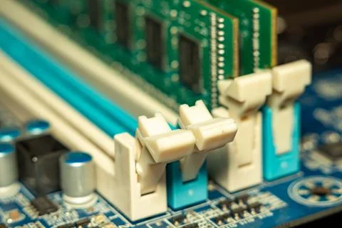 A detailed view of motherboard cpu socket with beige plastic retaining clips 스톡 사진