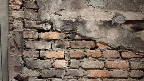 A detailed view of an old brick wall with noticeable cracks Stock-Footage 316236012