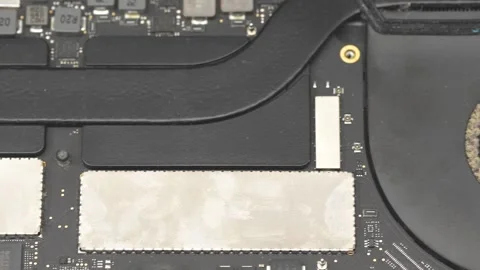 Detailed view of professional tech soldering components on laptop mainboard.. Stock Footage 336692293