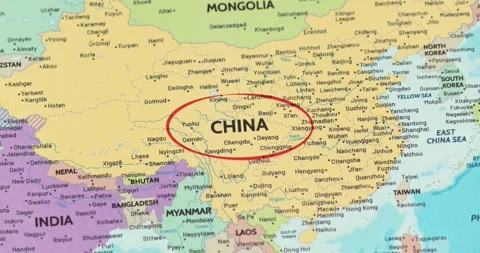 Detailed view of a red circle marking to china on a modern political world map Stockbeeldmateriaal 348178106