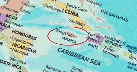 Detailed view of a red circle marking to jamaica on a modern political world map Stockbeeldmateriaal 348178258