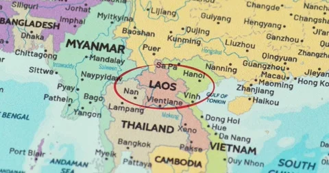 Detailed view of a red circle marking to laos on a modern political world map 動画素材 348178472