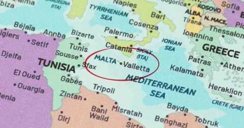 Detailed view of a red circle marking to malta on a modern political world map Видео 348178677