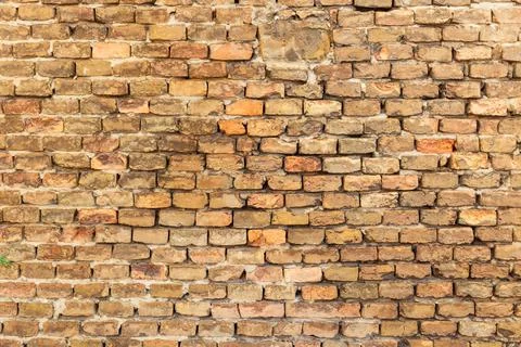 Detailed view of rustic stone wall with rough texture and earthy tones, ide.. Stock Photos