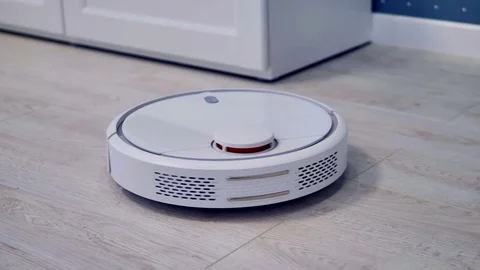 Detailed view on a self-moving robotic vacuum on the floor. Stock Footage 81675128