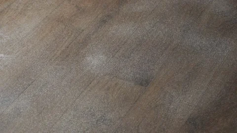 Detailed view on a self-moving robotic vacuum on the floor Stock Footage 142269542