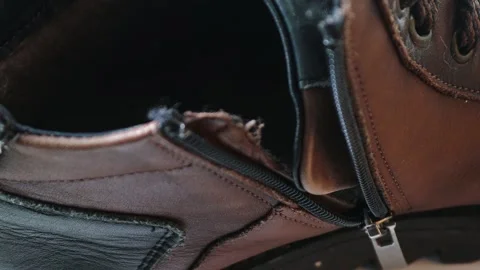 A detailed view of a shoe's upper section with a visible zipper 動画素材 322535457