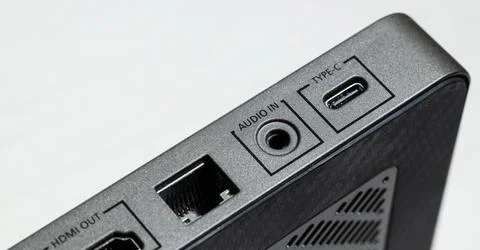 Detailed view of the side panel of a sleek electronic device showcasing vario Foto stock