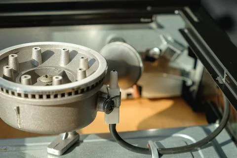 Detailed view of a silver mechanical component in a modern appliance setting Stock Photos