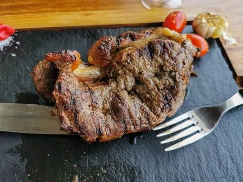 Detailed view of a sliced portion beef on fork, grilled beef steak Stock Photos