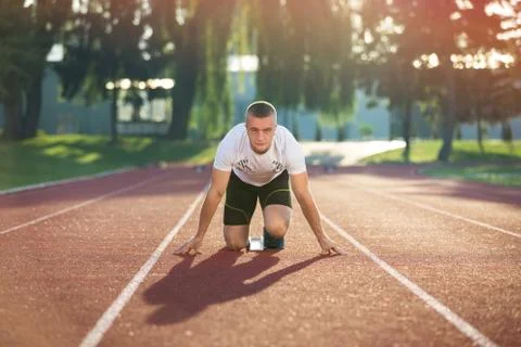 Detailed view of a sprinter getting ready to start. Selective focus. Stock Photos