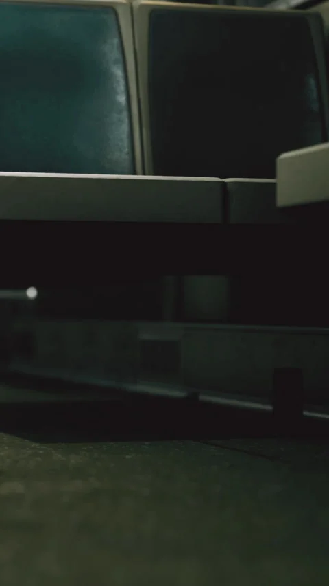 Detailed view of a table and floor in a dimly lit indoor space 動画素材 334259701