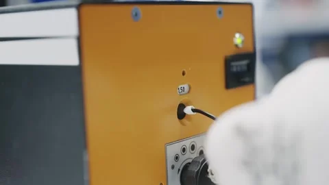 Detailed view of testing wire crimp equipment within a cable production facil Stock Footage 319503816