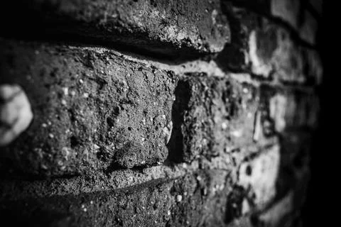 Detailed view of textured brick wall highlighting weathered surfaces in Stock Photos