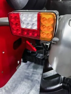 Detailed view of tractor tail light highlighting functionality and design in 写真素材