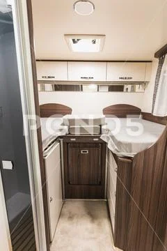 Detailed view of white and brown caravan interior Stock Photos