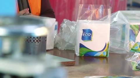 Detailed view of worker packing absorbent paper Stock Footage 56541396