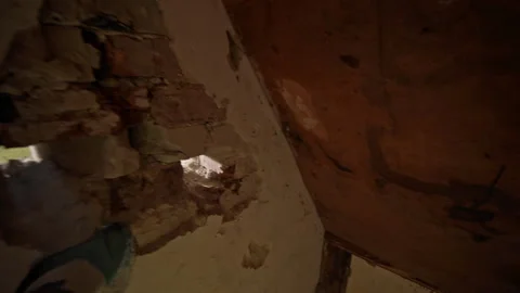 The Detailed Wall Repair Process Effectively Demonstrating the Removal of Stock Footage 313844926