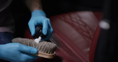 Detailing and cleaning of interior front seats at luxury modern cars. Car care Stock Footage 94900013