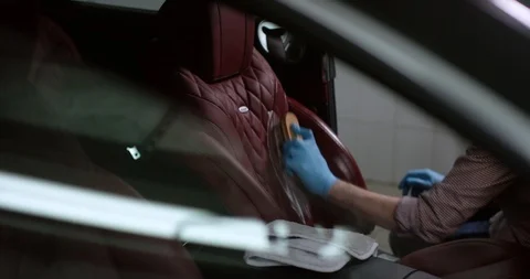 Detailing and cleaning of interior front seats at luxury modern cars. Car care Video stock 94900719