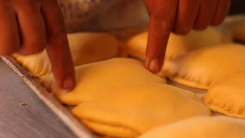 Detailing empanadas for baking 스톡 동영상 130086899