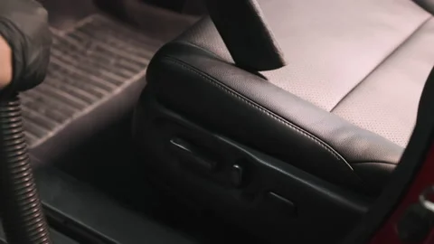 Detailing of a red car. Man cleaning car interior Stock Footage 209119443
