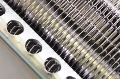 Details of the car engine radiator. Macro close-up of the radiator plates. Stock Photos